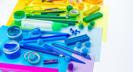 School accessories are laid out in the form of a rainbow. white background.