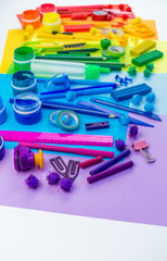 School accessories are laid out in the form of a rainbow. Copy space. white background.