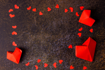 Valentine day concept. Red paper origami hearts.