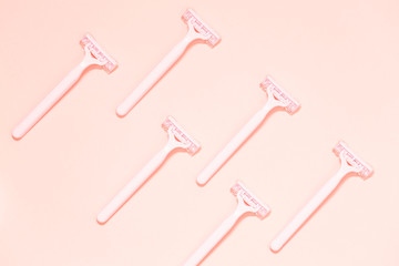 Pink female razors isolated on the color background. Set of razors on pink background. Pink women's disposable razors . Hygiene skin body care concept. Hair removal.