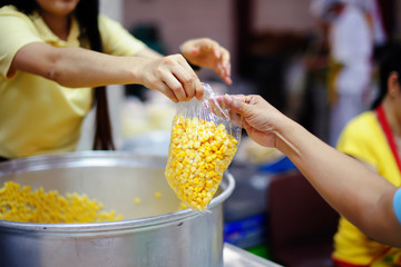 The hands of beggars receive donated food as a share in society : the concept of hunger
