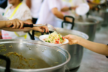 Poor people receiving food from donations : the concept of social sharing