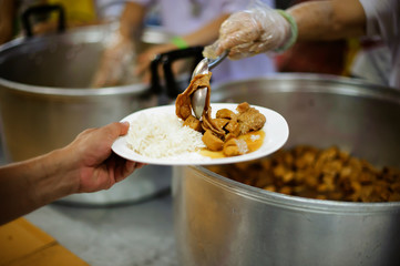 The Hand of the Beggars receives charity food from fellow human beings : the concept of the beggar...