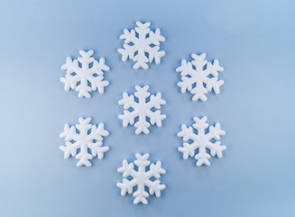 Pattern of decorative snowflakes on a blue background