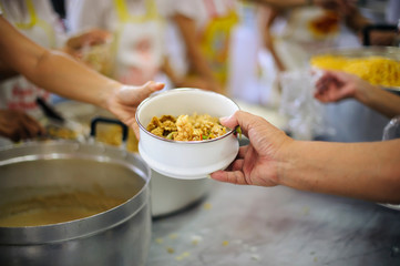 Food donation in the poor community of volunteers : Social concept of poor people sharing.
