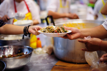 Food donation in the poor community of volunteers : Social concept of poor people sharing.