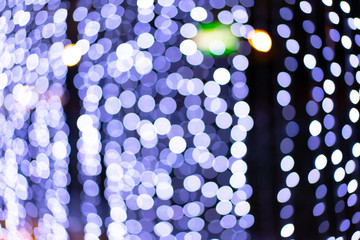 Abstract Circle Bokeh Blur purple,blue and green Light Texture on bright Background.Beautiful Night light in the City on Chrismas.Natural,Abstract,Backdrop Concept.