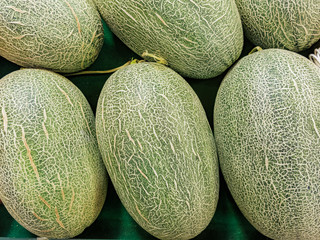 ripe melon on wooden table