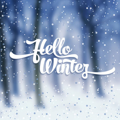 White text with snow on the background of snow-covered forest. Hello Winter lettering for invitation and greeting card, prints and posters. Calligraphic design.