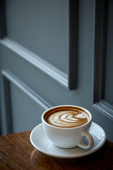 Cup of coffee with heart pattern