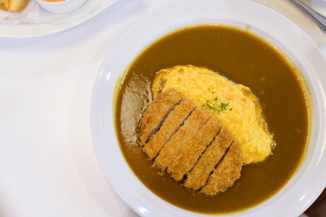Curry and rice with fried Pork with omelet, Japanese food.