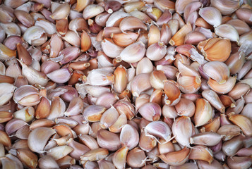 garlic pile texture background fresh garlic on market / spicy cooking ingredient garlic for thai food