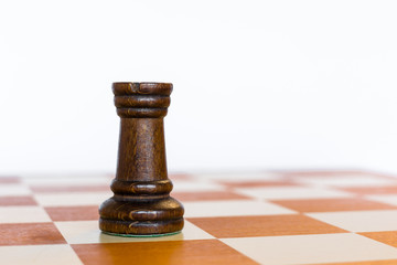 Black rook on white square on chessboard