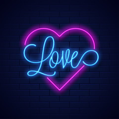 Neon text love and heart shape on blue brick wall background. © Abdul Qaiyoom