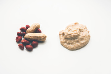 Healthy Peanut chutney made using Groundnut / Shengdana or mungfali. served in a small bowl with raw whole. Selective focus