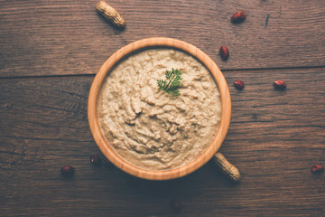 Healthy Peanut chutney made using Groundnut / Shengdana or mungfali. served in a small bowl with raw whole. Selective focus