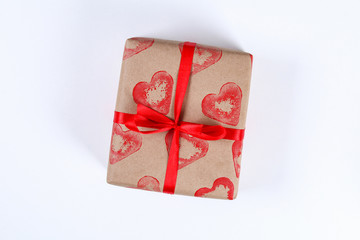 Diy. Gift wrapping for Valentine's Day. Kraft paper gift and potato stamp in the shape of a heart...