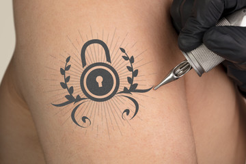 Hand tattooing colorful communication, leadership and creativity concept on naked clear skin