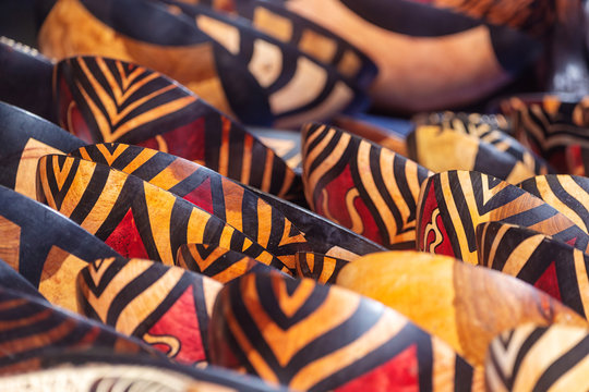 Tribal colored bowls in street market souvenir store in South Africa