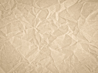 Texture of beige crumpled craft paper. Texture for design, abstract background