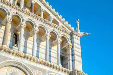 Fototapeta premium Day view of Pisa Cathedral with Leaning Tower of Pisa on Piazza dei Miracoli in Pisa, Tuscany, Italy. The Leaning Tower of Pisa is one of the main landmark of Italy