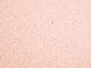 Texture of light red cardboard closeup, abstract paper background