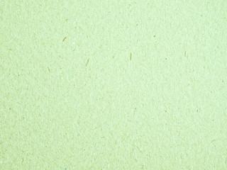 Texture of light green cardboard closeup, abstract paper background