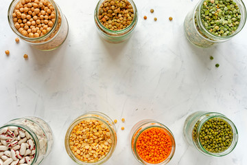 Border of glass jars with pulses and legumes