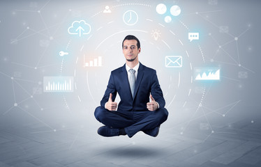 Elegant calm businessman levitates in yoga position with data circulation concept
