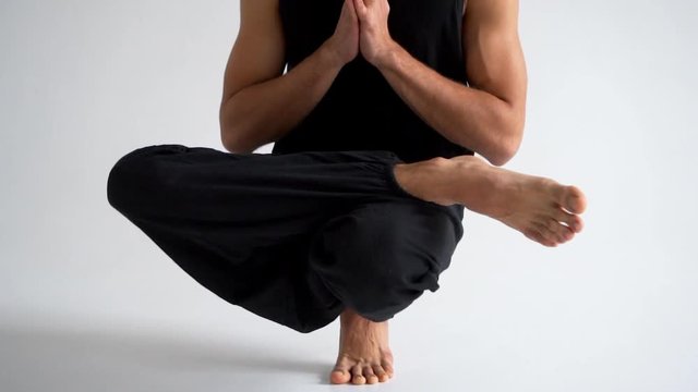 Man practicing intense yoga asana