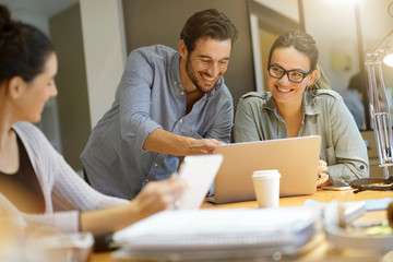 Colleagues workshopping business ideas in modern co working space