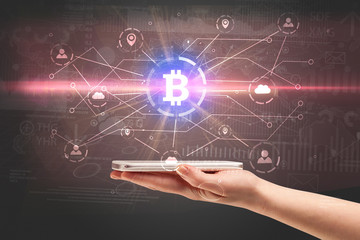 Hand using phone with cryptocurrency bitcoin link network and online concept

