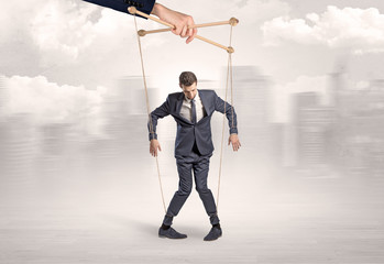 Puppet man with big city great power concept
