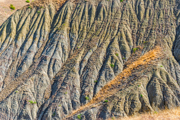 Freakish hillsides  of  blue clay