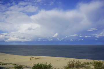 Fototapeta na wymiar Sea landscape of the Baltic sea with coastal sand dunes of the Curonian spit.