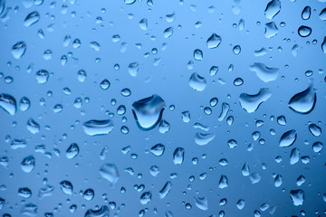 Blue tone for drops of water or rain drops on window glass