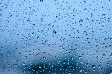 Blue tone for drops of water or rain drops on window glass