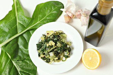 Swiss chard cooked with lemon, garlic and olive oil high angle