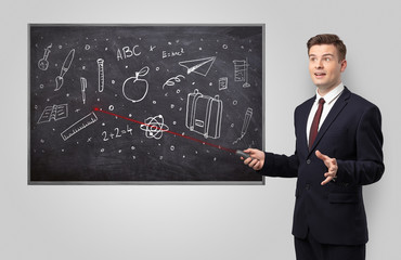 Handsome young teacher with laser pointer teaching 
