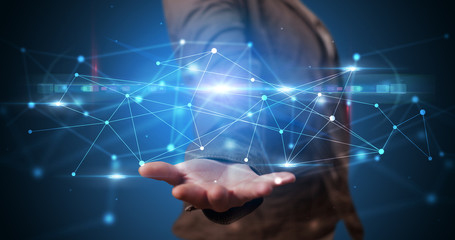 Handsome person holding hologram screen displaying modern cloud based web system technology
