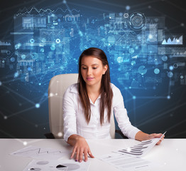 Young manager at the office making report and statistics