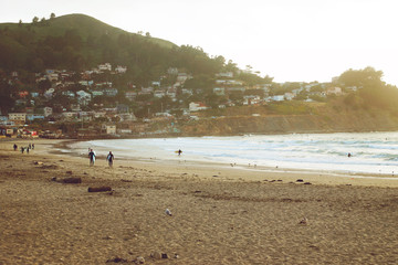 Surfers just before sunset