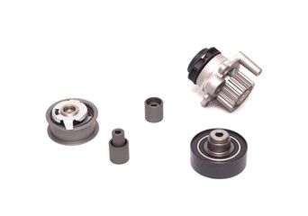 Set of rollers of the automobile engine timing system and the cooling pump on a white background, motor cars