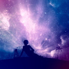 Fototapeta premium Young woman sunbathing on a beach. Double exposure silhouette of the relaxing girl. Palm and lifeguard tower. Night sky with stars on backdrop. Elements of this image furnished by NASA