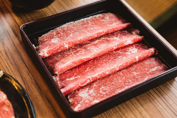 Rare slices authentic A5 Grade Japanese Wagyu beef with high-marbled texture for Shabu.