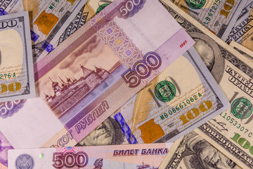 Fototapeta na wymiar Background of the different american and russian banknotes