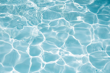 Texture of water in swimming pool for background