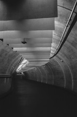 Empty, dark tunnel in an underground parking, shot with analogue black and white film
