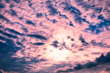 Beautiful pink sunset sky with clouds