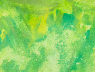 Strokes of green water-colour are on a paper. Texture.